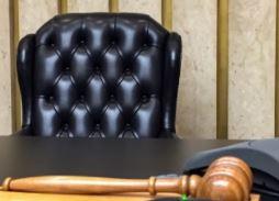 Empty judge's chair with gavel