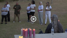 KWTX screengrab. Nonprofit lights candles for inhumane prison conditions.